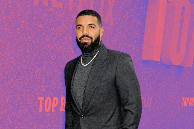 Drake wearing a turtleneck under a suit jacket