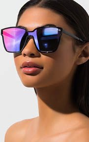 The QUAY After Dark Sunglasses creates a cool look with their slightly winged square lenses.