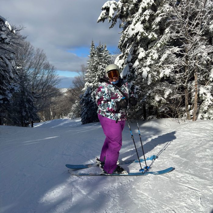 Read Mirna's blog - Mirna Valerio smiling on a snowy ski trail.