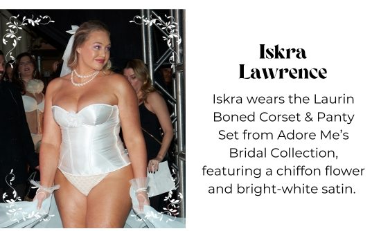 Iskra Lawrence - Iskra wears the Laurin Boned Corset and Panty Set from Adore Me Bridal Collection, featuring a chiffon flower and bright-white satin.