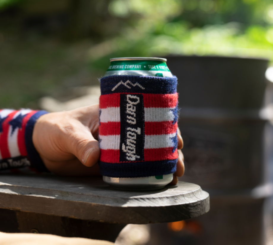 Our Limited Edition Captain Coozie snuggled around a beverage being enjoyed outdoors by some happy American.