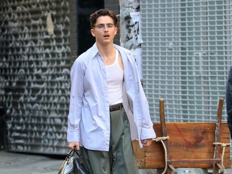 Image may contain: Timothée Chalamet, Accessories, Bag, Handbag, Belt, Adult, Person, Clothing, Pants, Footwear, and Shoe