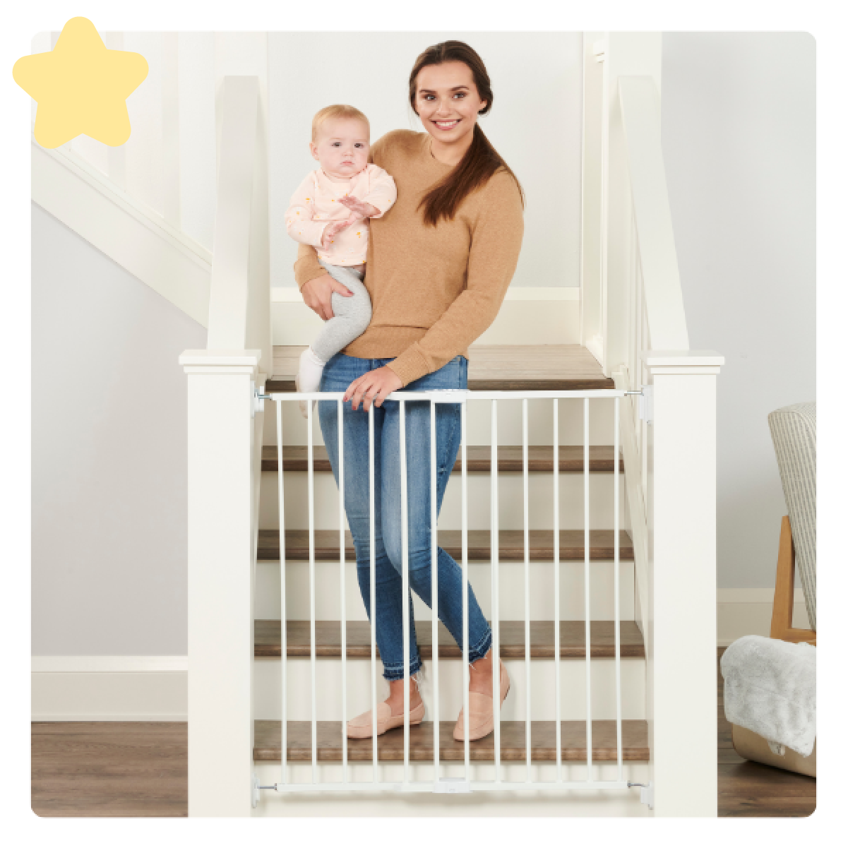 Mom Carrying Baby Down the Stairs in front of Top of Stairs Gate