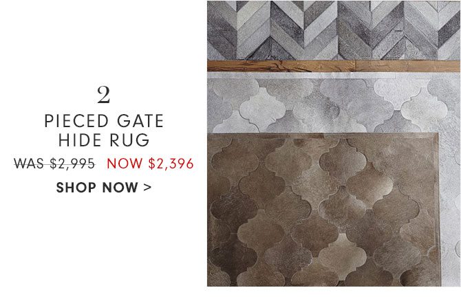 2. PIECED GATE HIDE RUG - WAS $2,995 NOW $2,396 - SHOP NOW