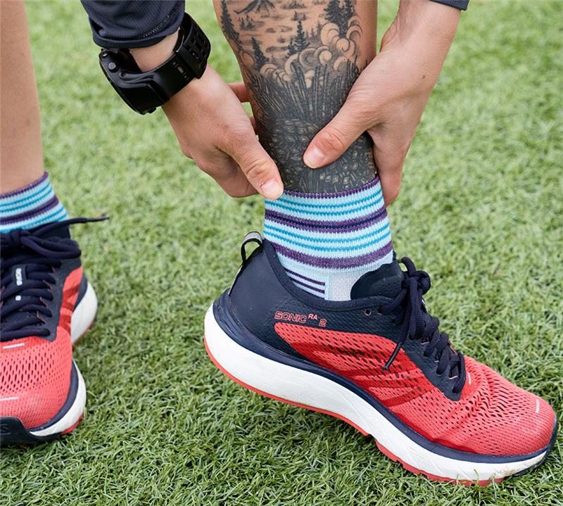 Athlete on turf shows off their NEW Vertex 1/4 socks, sweet kicks, and tattooed calf.