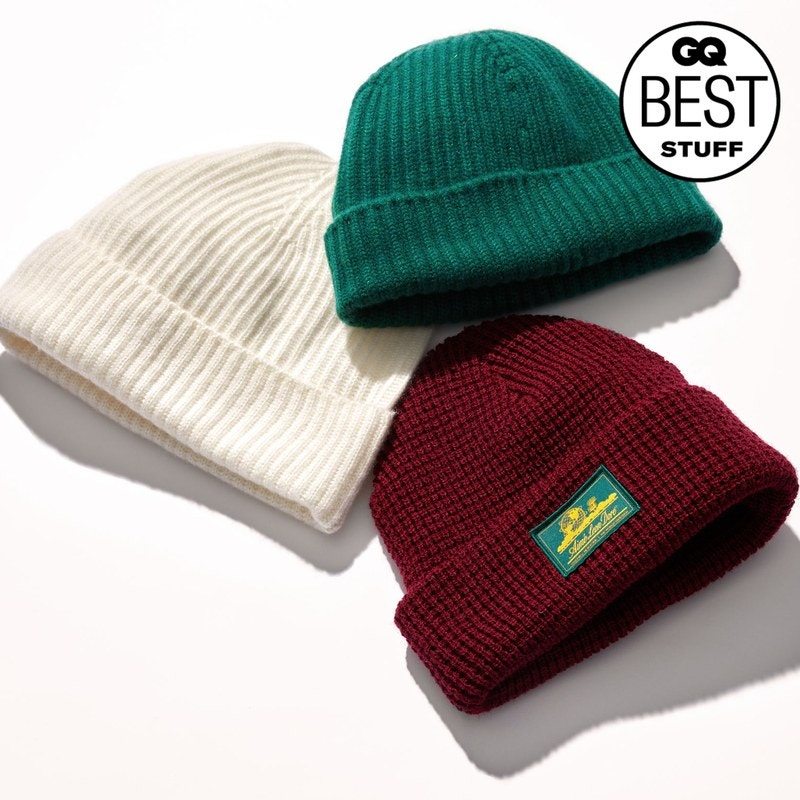 Three beanies on a tan background