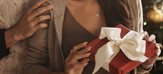 Happy couple exchanging gifts on Christmas