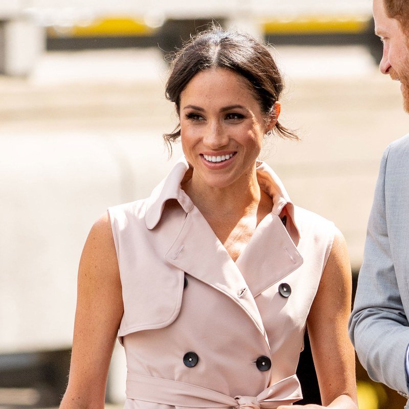 Meghan Markle pairs an easy updo with pink cheeks.