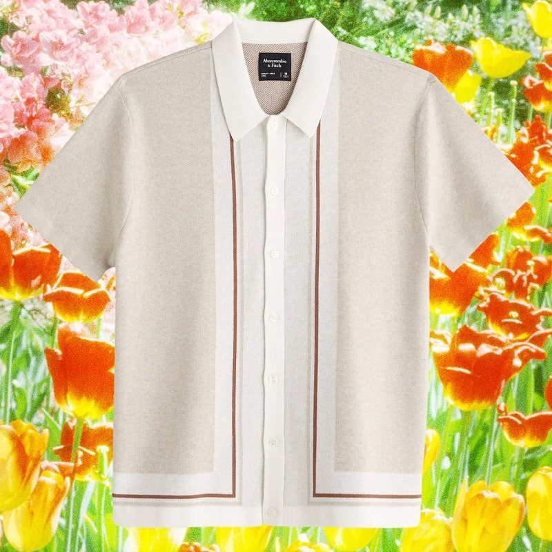 A collage of a full button down polo on a background of bright colorful spring flowers