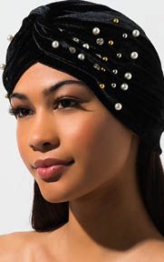 Bon Voyage Velvet Headwrap is a soft knit, velvet based head wrap complete with pleated detailing, all over faux pearl embellishment and a twist front center.