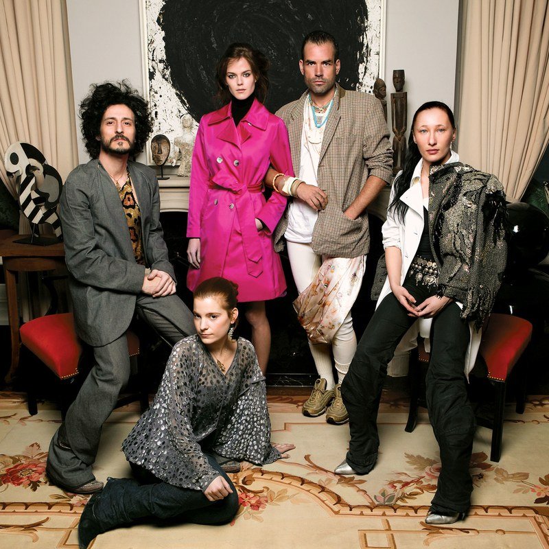 As Four, clockwise from left: Gabi, model Shannan Click in a pink As Four Kate Spade trench, Kai, Ange, and Adi.