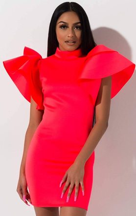 The AKIRA Label Firecracker Mini Dress is a scuba knit, bodycon fitting special occasion dress complete with a high mock neckline, mini hem and layered, ruffle sleeves and slip on fit.
