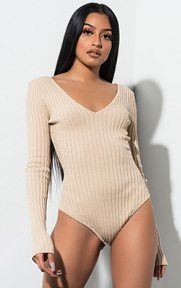 Express Yourself Long Sleeve Bodysuit is made of a thick, ribbed knit material, long sleeves, a flattering v-neckline and a thong crotch, snap close bottom.