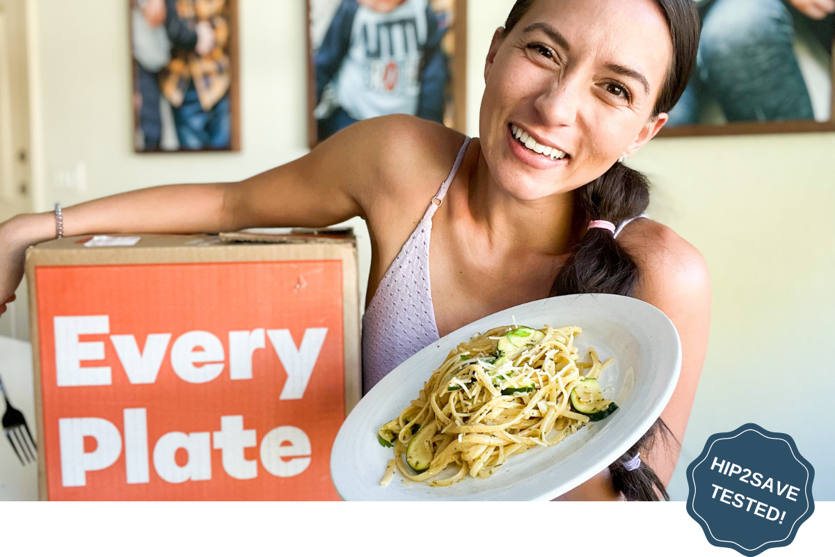 Woman holding plate of dinner cooked using EveryPlate Meal Delivery Kit