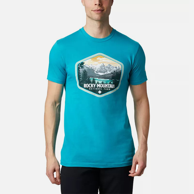 Close-up of a man wearing a tee celebrating Rocky Mountain National Park. 