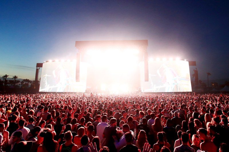 Crowd and a lit-up stage at Coachella