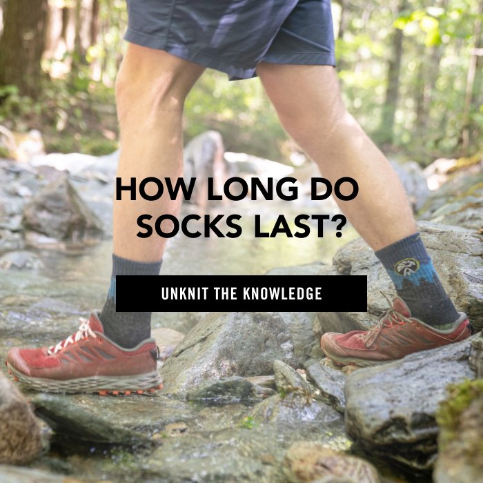 Read How Long do Socks Last - a hiker steps across a stream wearing AT socks