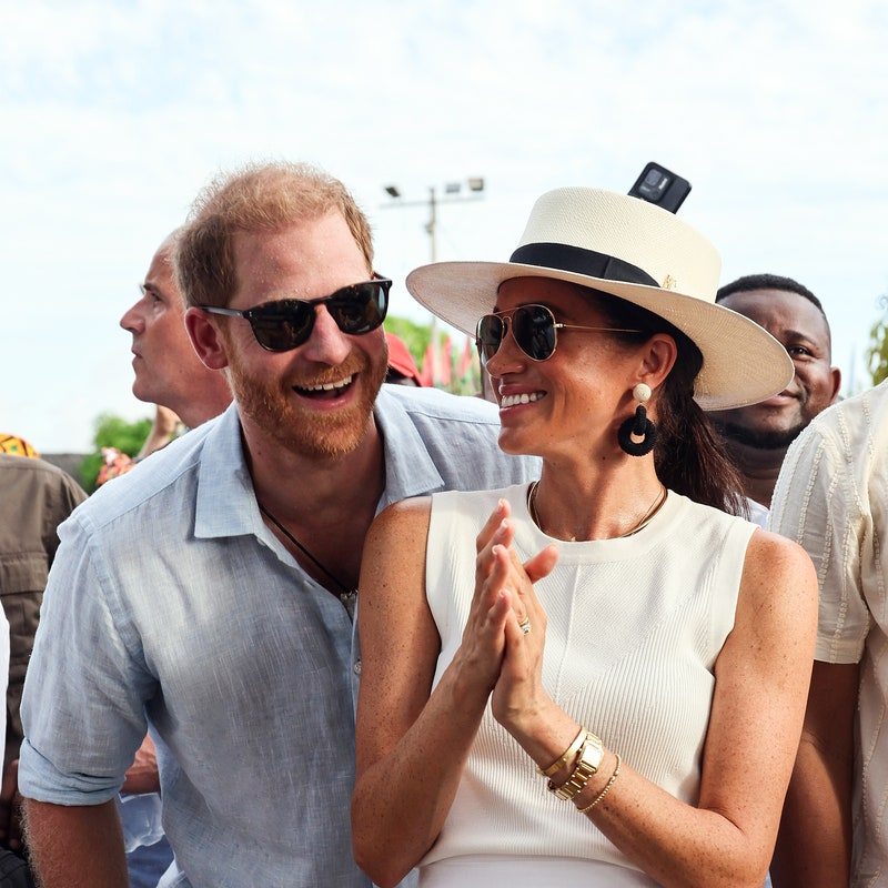 Image may contain: Prince Harry, Duke of Sussex, Meghan, Duchess of Sussex, Accessories, Glasses, Clothing, Hat, and Jewelry