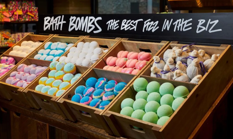 Lush Bath Bombs on Display in Wooden Crates with a sign that reads Bath Bombs The Best Fizz in the Biz