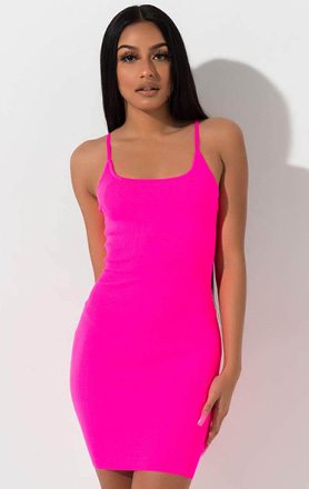 The AKIRA Label Highlighter Vibes Sweater Knit Mini Dress is a ribbed knit, bodycon fitting party dress complete with thin spaghetti straps, a scoop shaped neckline and leg baring mini hem.