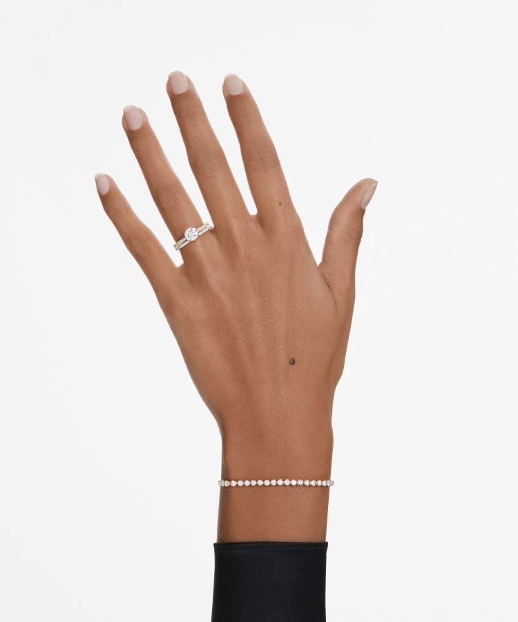 Model wearing Eternity solitaire ring and band