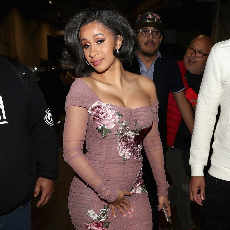 Cardi B in a sheer dusty rose-colored dress