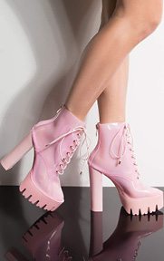 Run Away With Me Chunky Heeled Clear Bootie is a bold fashion choice complete with a super high block heel, a ridged platform sole, and an ankle height, PVC upper with a cotton candy tint, lined back zipper and adjustable laces.