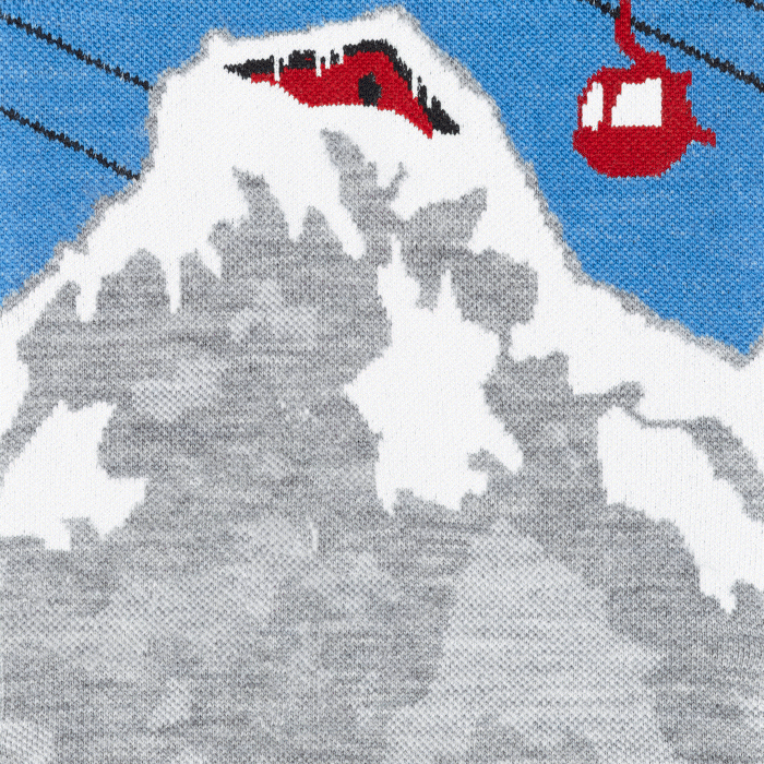 Shop Yeti Socks - OMG did you see that? A white yeti slides over a snowy mountain scene holding a beverage.