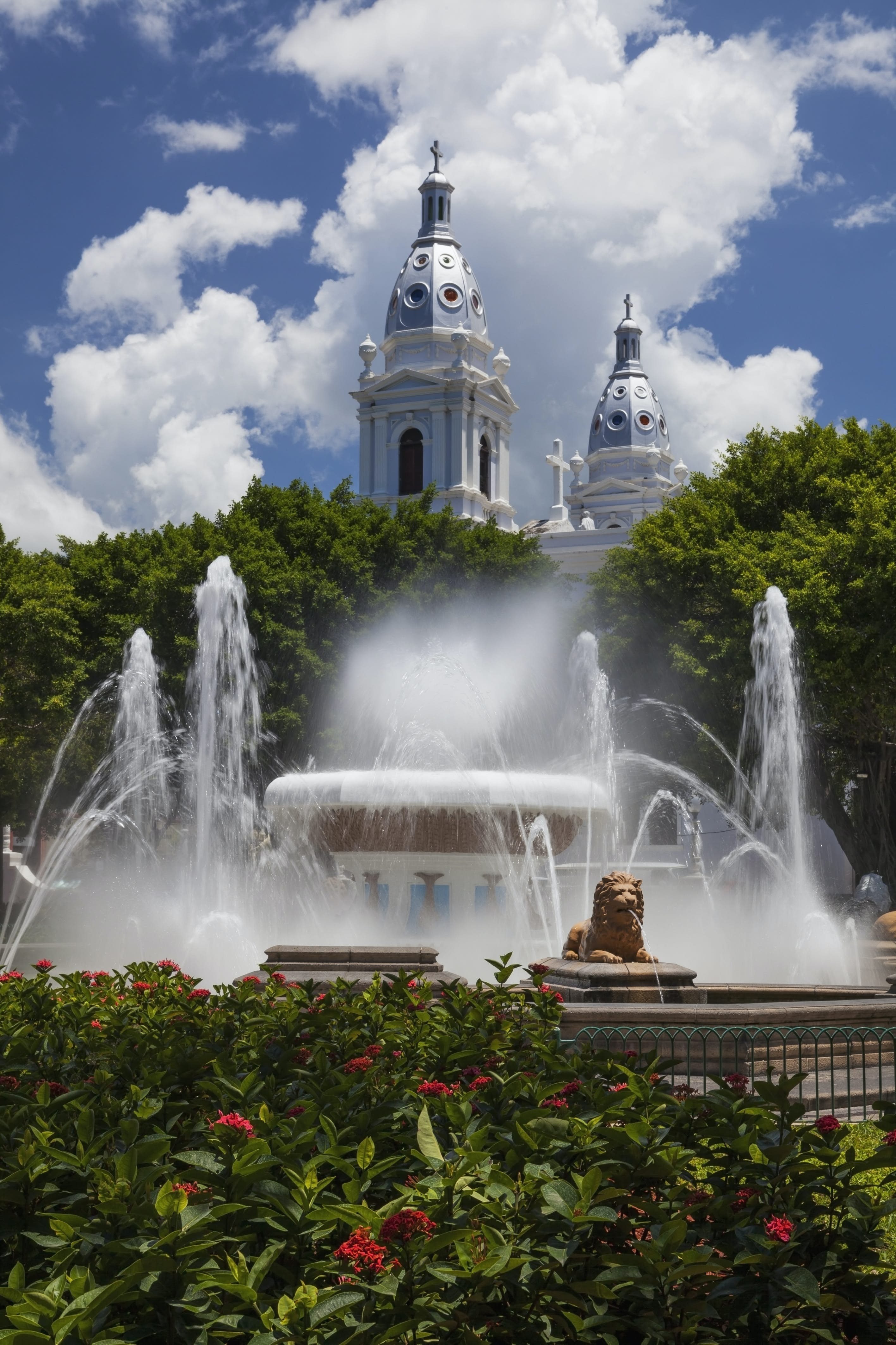 water fountain in front of large city building