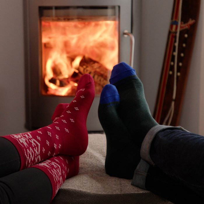 Watch the Yule Log video - Cozy sock-clad feet kicked up in front of a blazing woodstove