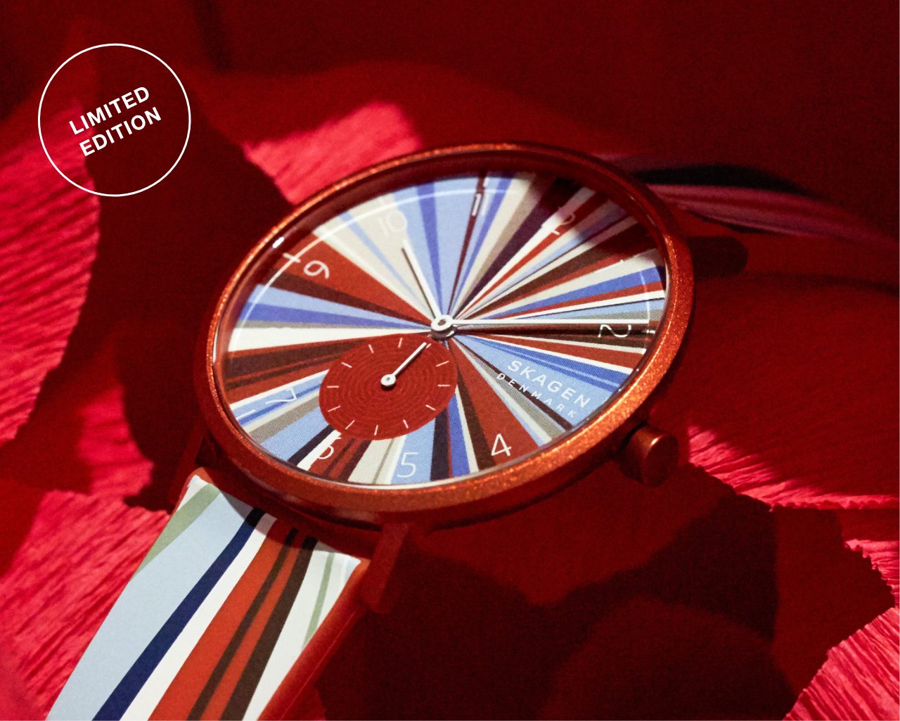 Limited Edition Red Colorburst watch uniquely multicolored—primarly in tones of red and white.