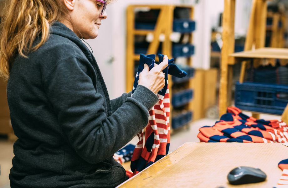 Someone in our Mill checks the quality of a batch of Captain Stripe socks.