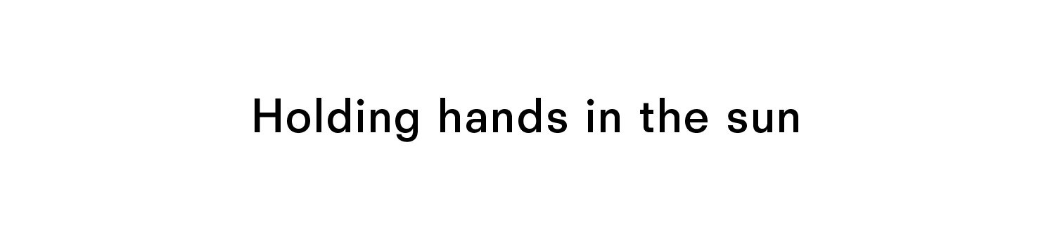 Holding hands in the sun