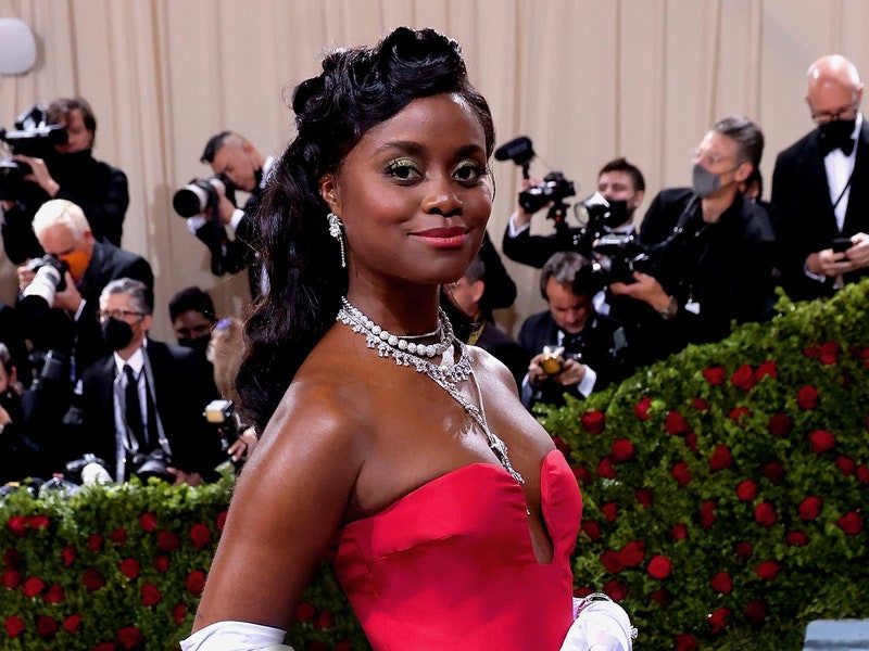 Image may contain: Human, Person, Denée Benton, Helmet, Clothing, Apparel, Fashion, Paparazzi, Evening Dress, Gown, and Robe