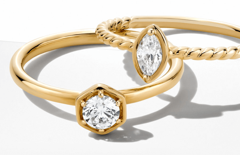 Image of two Stunning Diamond-Crowned Gold Engagement Rings.