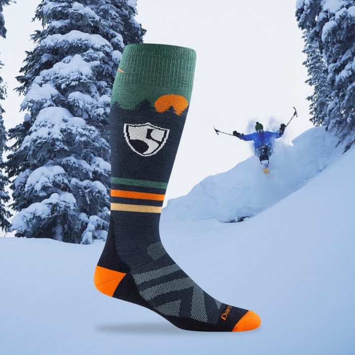 Shop the Sock - Trevor Kennison sails through powder on his sit ski, with the High Fives socks in the foreground