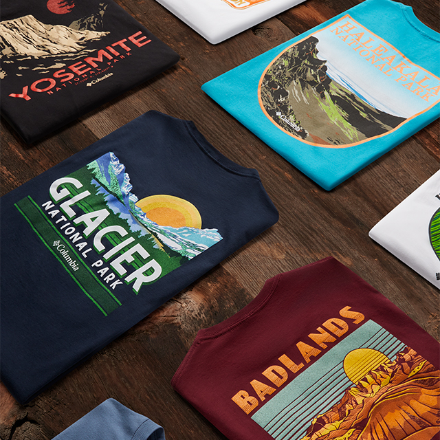 Close-up of assorted tees celebrating different National Parks. 