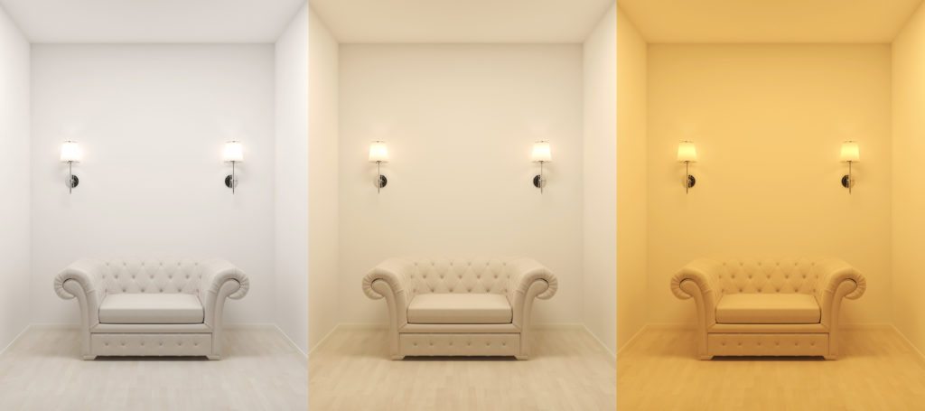 Sconces above a sofa at different color temperatures