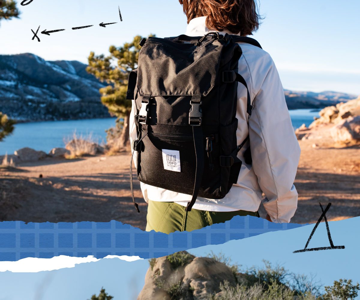 EXPLORE THE COLLECTION (A PERSON HIKING A ROCKY MOUNTAIN WITH A ROVER PACK ON THEIR BACK)