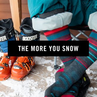 Read the blog - a skier lets their feet breathe between laps, wearing blue and red striped socks