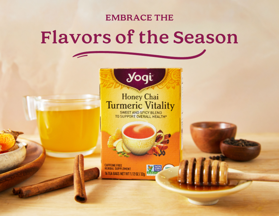 Yogi Honey Chai Turmeric Vitality sits on a counter next to honey and cinnamon sticks