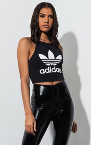 Cropped Halter Top is made from a stretch cotton fabrication with a high neckline, halter straps, an open back, cropped length, and a large adidas trefoil logo across the front.