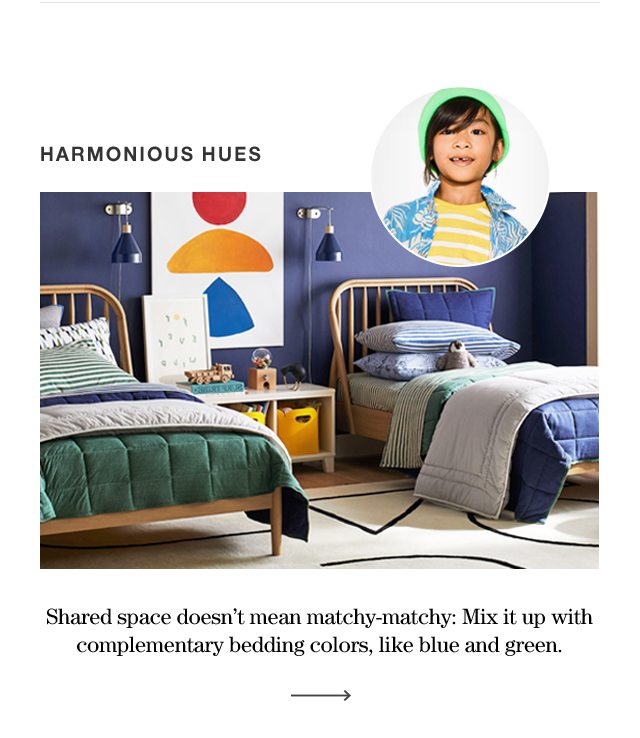 HARMONIOUS HUES Shared spaces doesn't mean matchey matchey: Mix it up with complementary bedding colors, like blue and green.
