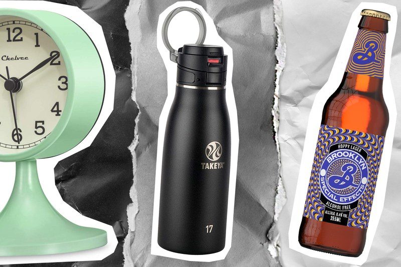 A clock, a travel mug, and a beer bottle 