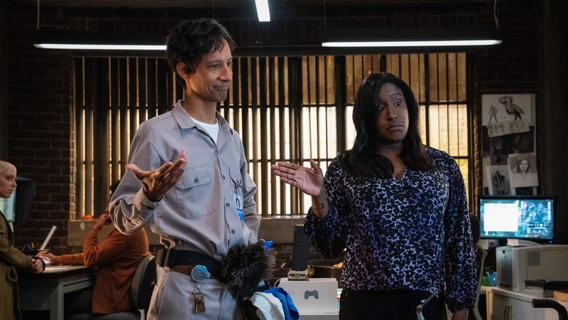 Image may contain: Screen, Electronics, Person, Adult, Hardware, Computer Hardware, Monitor, Danny Pudi, Furniture, and Chair