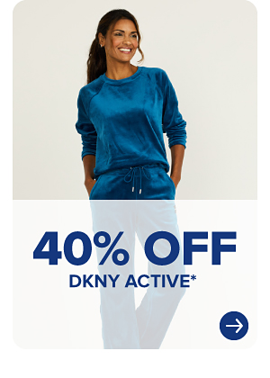 A woman in a blue activewear set. 40% off DKNY active.