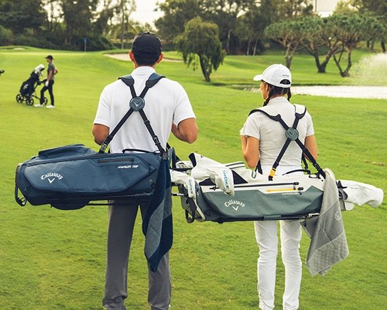 Two Golfers with Golf Bags