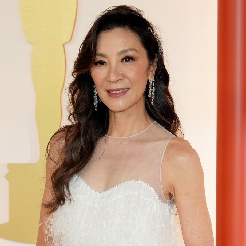 Image may contain: Michelle Yeoh, Face, Happy, Head, Person, Smile, Clothing, Dress, Fashion, Formal Wear, Gown, and Wedding