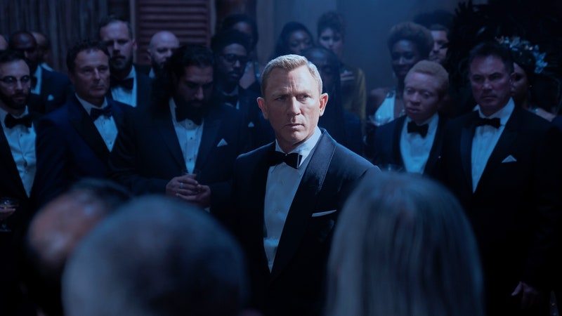 Image may contain: Clothing, Apparel, Human, Person, Daniel Craig, Suit, Coat, Overcoat, Audience, Crowd, Tuxedo, and Tie