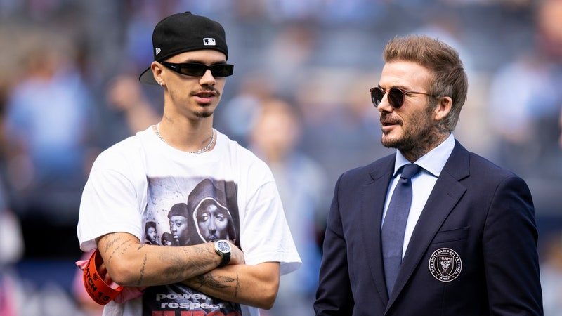 NEW YORK, NEW YORK - SEPTEMBER 21: David Beckham Owner of Inter Miami and Romeo Beckham on the pitch before the Major League Soccer match between the New York City and Inter Miami at Yankee Stadium on September 21, 2024 in New York City. (Photo by Ira L. Black - Corbis/Getty Images)